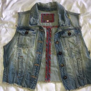 Worn sleeveless denim vest